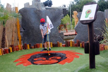 Family playing Adventure Golf