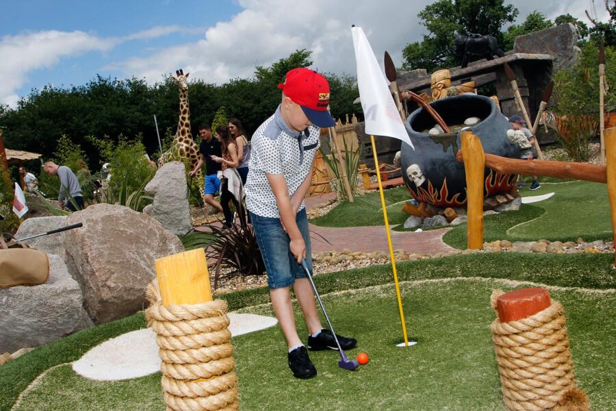 Family playing Adventure Golf