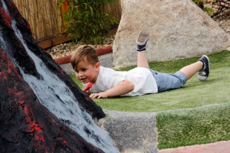 Family playing Adventure Golf